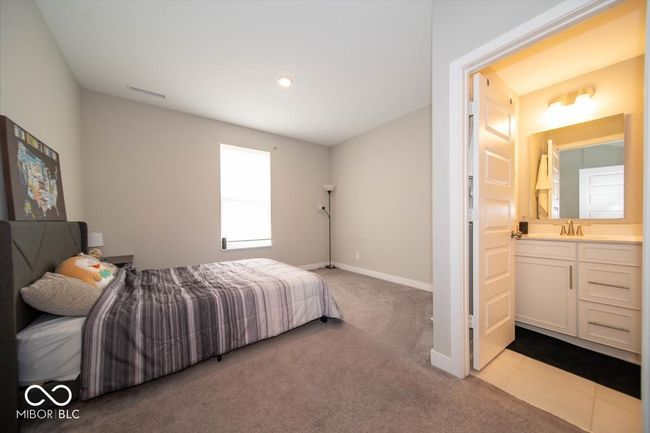 bedroom featuring carpet floors and ensuite bathroom | Image 13