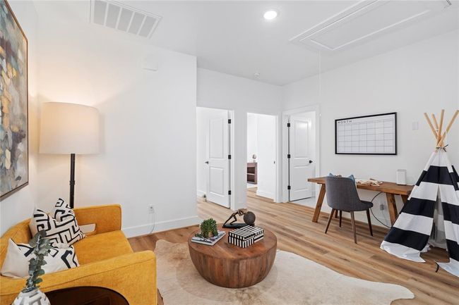 This well-designed upper-level area offers endless possibilities, from a home office to a playroom or additional lounge space. | Image 15