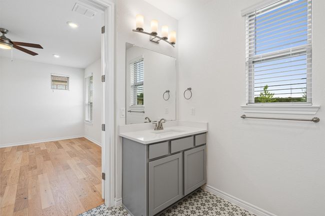 The second vanity in the primary bath with another window for natural light. | Image 15