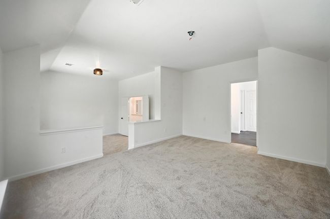 Bonus room with lofted ceiling and carpet flooring | Image 16