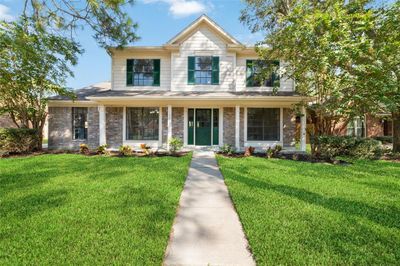 Beautiful two-story home located in the heart of Fairfield with mature trees, low maintenance landscaping, and a welcoming covered porch. | Image 1