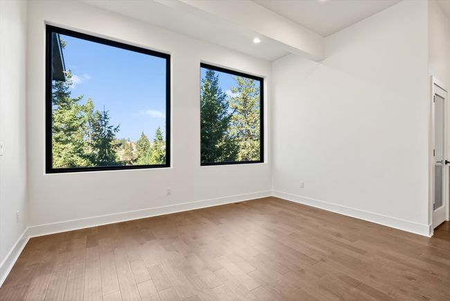 Dining area with large picture windows | Image 19