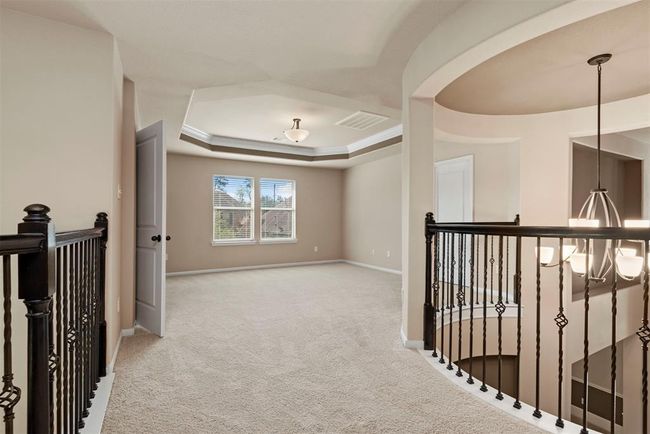 Game room upstairs with tray ceiling. | Image 27