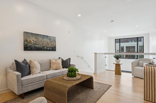 Upstairs, the airy loft offers endless possibilities—use it as a media lounge, creative studio, or cozy guest hangout. | Image 24