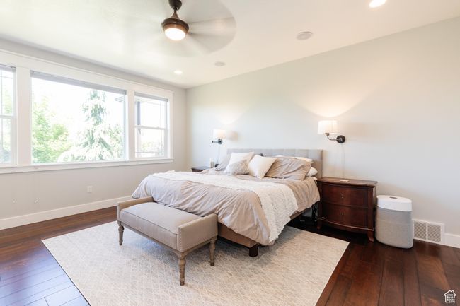 Bedroom with dark wood-style floors, recessed lighting, and a ceiling fan | Image 21