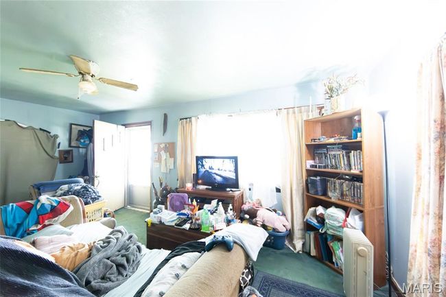 Carpeted bedroom featuring a ceiling fan | Image 17