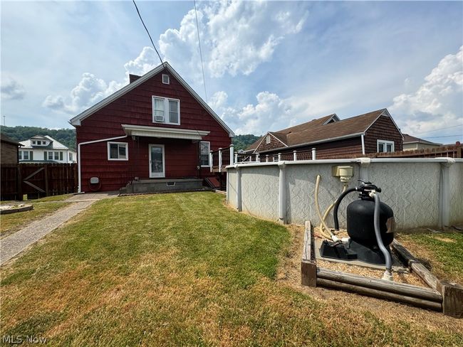 Rear view of house with a lawn | Image 28