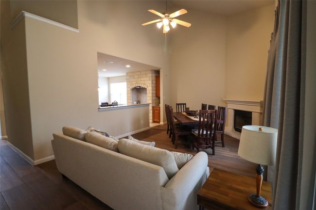 Family room used as a dining/Family room. Notice the fireplace. | Image 12