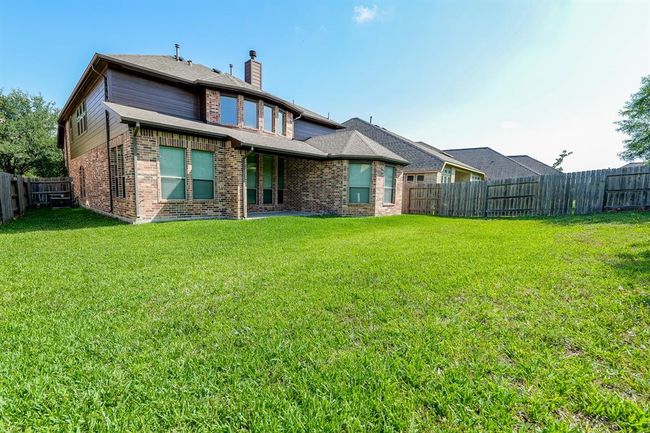 Beautifully impressive in its rear exterior view, this special residence welcomes a feast of outdoor entertaining! | Image 31