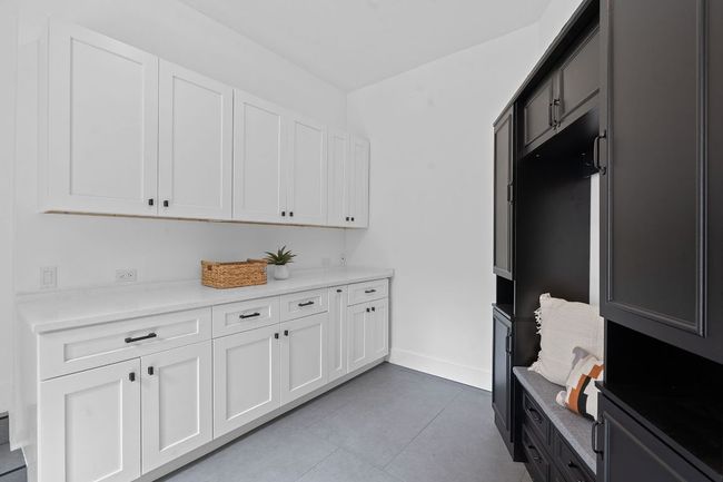 Mud room with lots of cabinet space and quartz top | Image 16