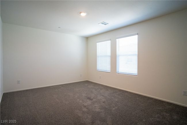 Spare room with dark colored carpet and baseboards | Image 14