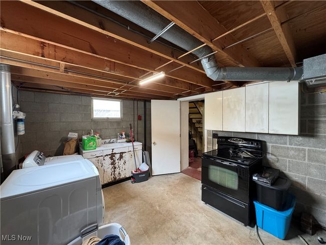 Basement featuring washer and dryer and stairs | Image 42