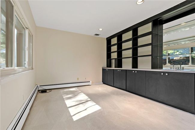 Den with built-in shelving. | Image 13