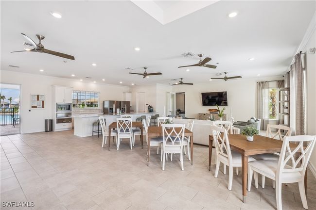 Dining area with light tile patterned flooring | Image 9