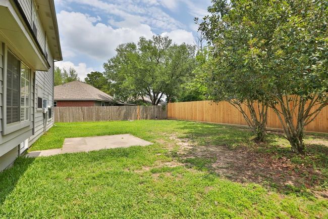Lovely yard with new fence. | Image 34