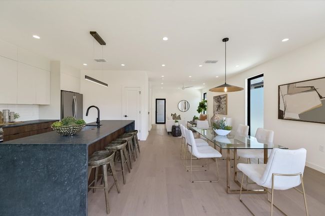 Dining area with light wood finished floors and recessed lighting | Image 13