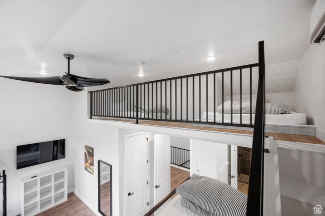 Stairway with ceiling fan and wood-type flooring | Image 24
