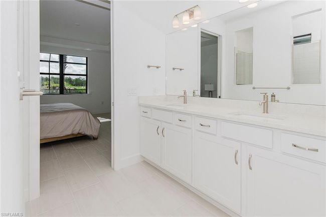 Bathroom featuring double vanity and tile patterned floors | Image 26