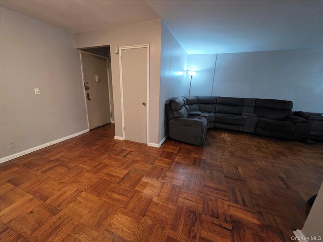 Living room featuring baseboards | Image 7