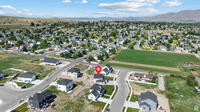 Aerial view of property and surrounding area with a mountain backdrop and nearby suburban area | Image 43