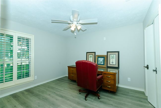 Bedroom featuring light wood-style flooring and a ceiling fan | Image 18