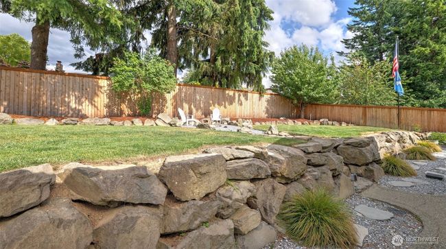 Beautifully landscaped pathways adorned with vibrant plants, thoughtfully designed for your enjoyment | Image 37