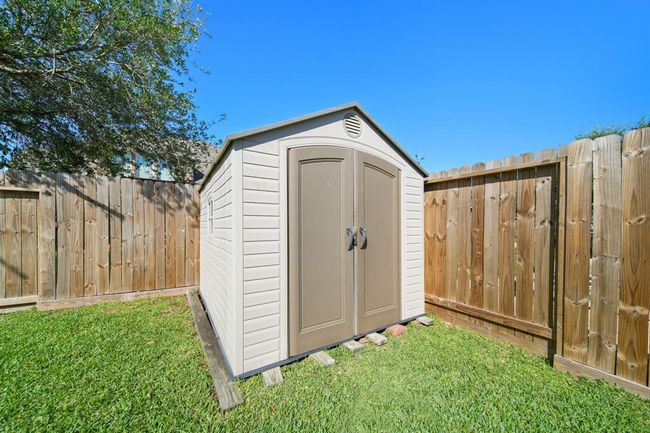 Included is a storage shed for storing outdoor toys, lawn equipment, etc... | Image 46