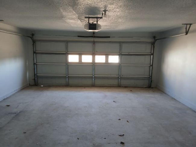 Garage with a garage door opener | Image 14