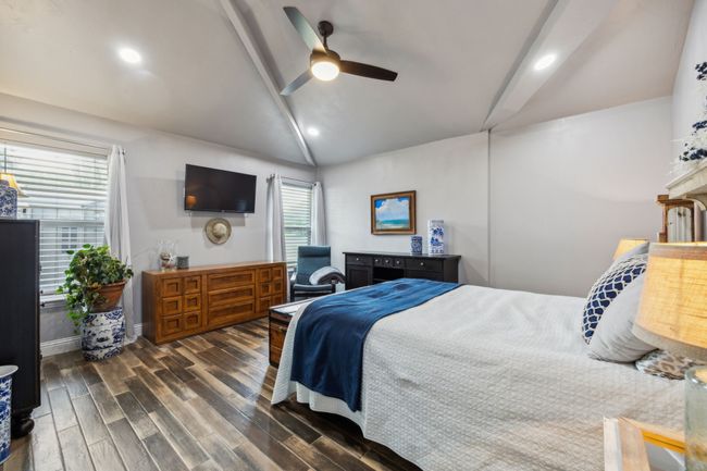 Private Bedroom with Vaulted Ceilings and Recessed Lighting | Image 33