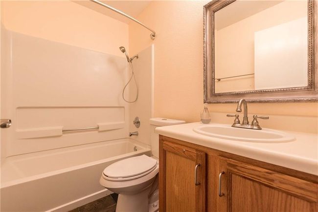 Bathroom featuring vanity and shower combination | Image 5