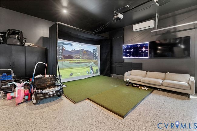 Game room featuring golf simulator and a wall mounted air conditioner | Image 38