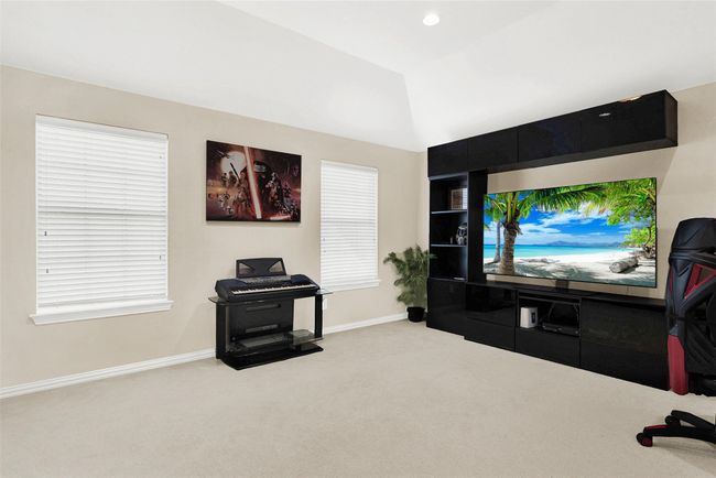 This fourth living area is great for gaming or home office, exercise, or hobby space | Image 29