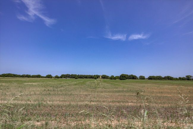 View of undeveloped land from backyard featuring rural landscape. | Image 38