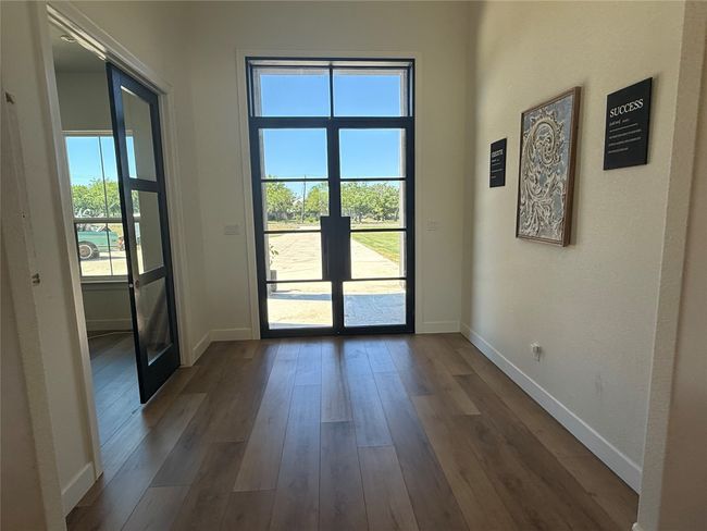 Doorway to outside with plenty of natural light, dark wood finished floors, and french doors | Image 19
