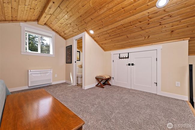 View of closet and half bath in loft bedroom. | Image 24