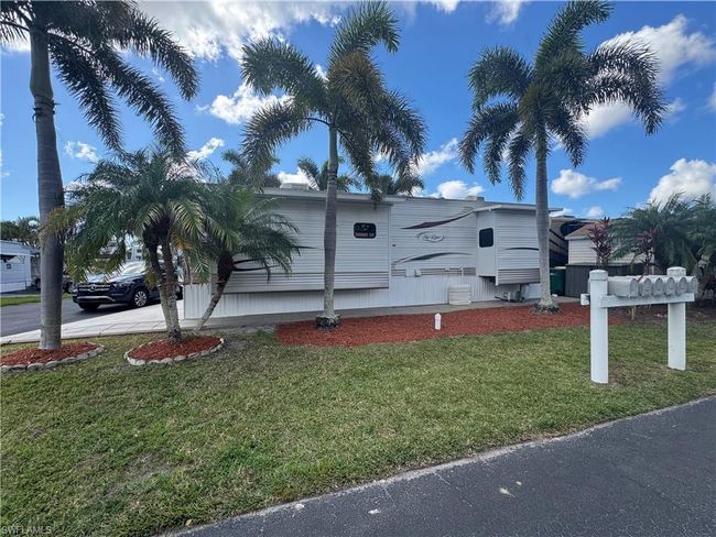 View of property exterior with a yard | Image 33