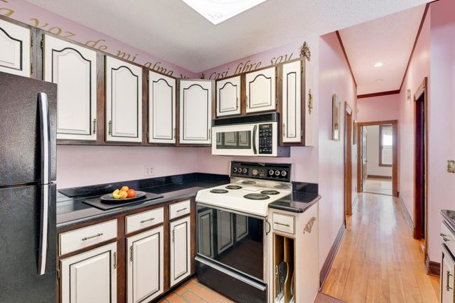 Lots of cupboard and counter space, plus a newer fridge. | Image 14