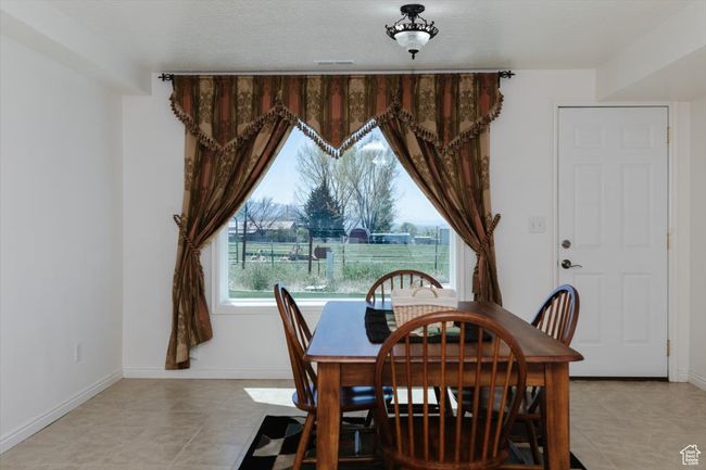 Dining space featuring baseboards | Image 49