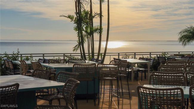 View of patio / terrace featuring outdoor dining area and a water view | Image 19