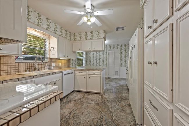 Kitchen with beautifully done cabinets | Image 12