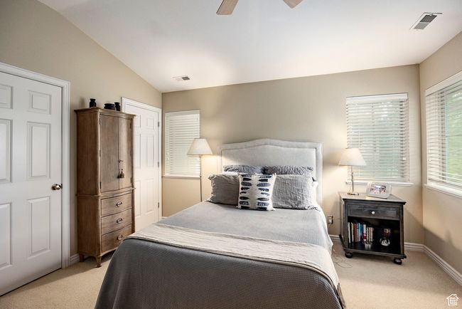 Bedroom featuring light carpet | Image 18