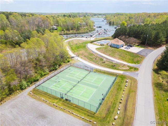 Bird's eye view of tennis, pool, and boat dock | Image 4