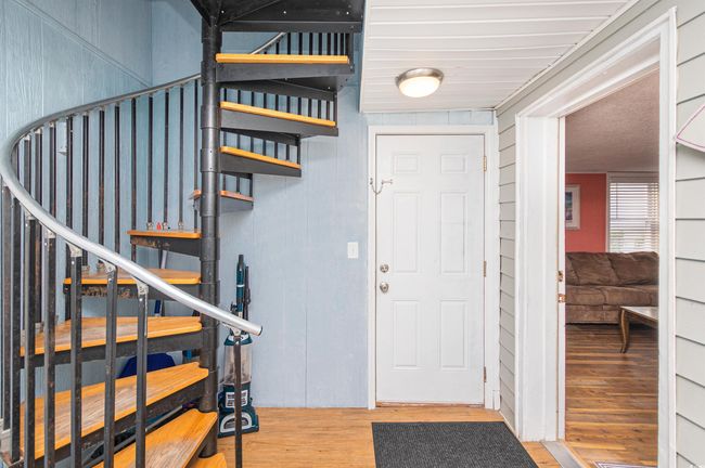 Foyer featuring wood finished floors and stairs | Image 8