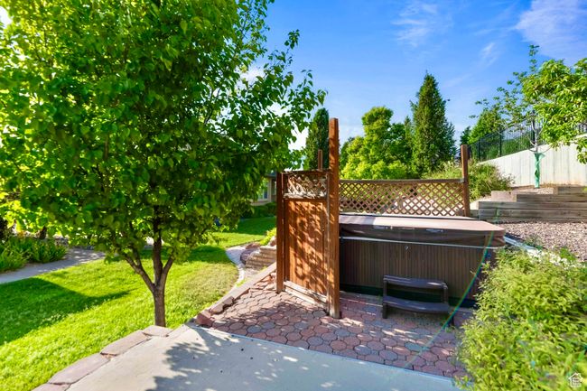 View of patio / terrace featuring a hot tub | Image 24
