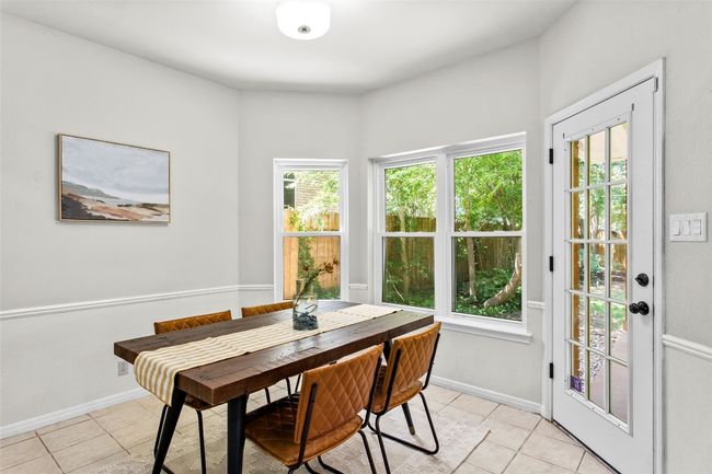 This space opens to the covered backyard patio | Image 19