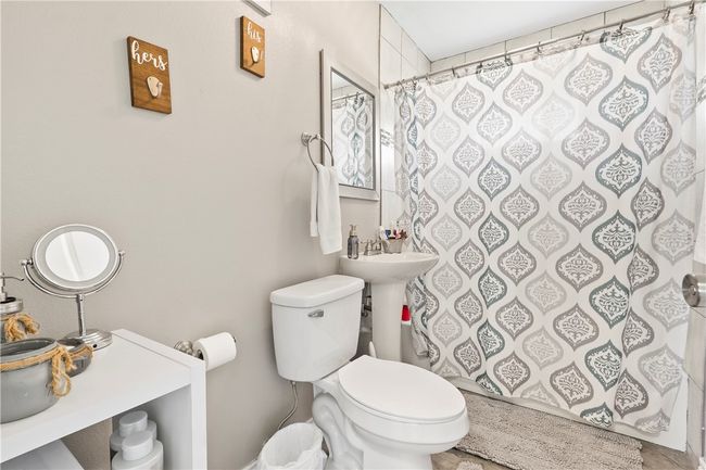 Full bath with a shower with shower curtain | Image 16