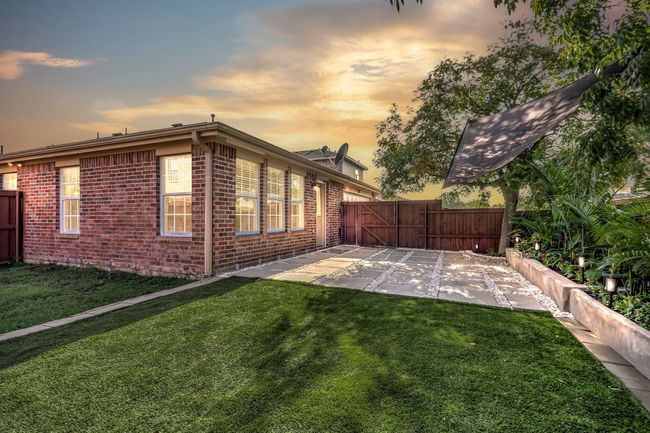 Property exterior at dusk featuring a patio and a yard | Image 31