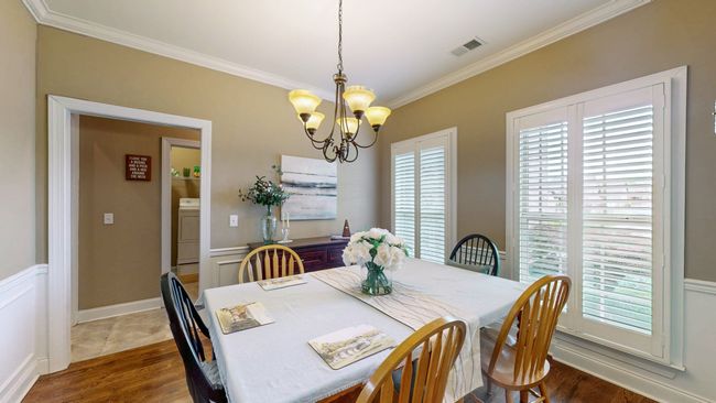 The dining room is large offers a large space for family and friend gatherings. | Image 13