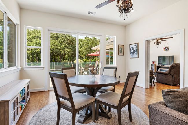 Great space for an extra dining area or sitting area to look out of the gorgeous backyard | Image 14