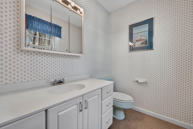Powder room conveniently located off family room | Image 36